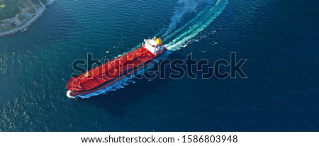 Aerial drone ultra wide panoramic photo of industrial crude oil - fuel and petrochemical tanker cruising open ocean deep blue sea