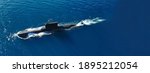 Aerial drone ultra wide photo of latest technology naval armed forces submarine cruising in deep blue open ocean sea