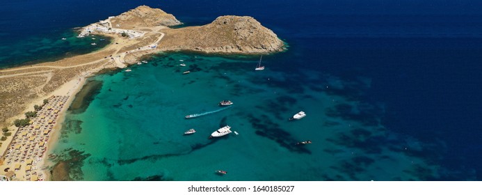 Aerial drone ultra wide photo of famous beach of Agia Anna in island of Mykonos, Cyclades, Greece
