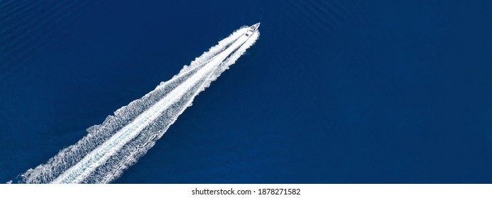 Aerial Drone Ultra Wide Photo Of Speed Boat Cruising Fast In Deep Blue Aegean Sea