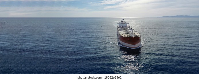 Aerial drone ultra wide photo of latest technology in safety standards crude oil tanker cruising Saronic Gulf deep blue sea, Greece