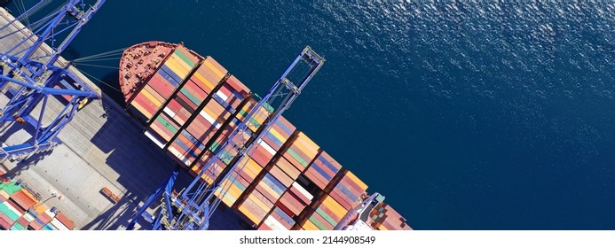 Aerial drone ultra wide top down panoramic photo with copy space of container tanker anchored in loading - unloading container terminal port - Powered by Shutterstock