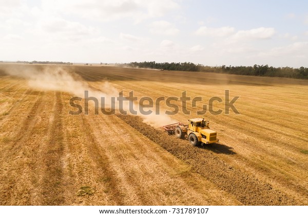 Aerial drone video of the harvesting machine in the\
field. 