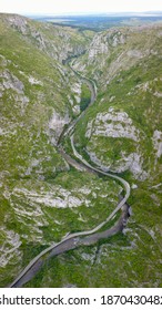 Aerial Drone View Above Sohodol Gorges. A Road Wides Along The River Through Its Tight Rocky Canyon. Carpathia, Romania.