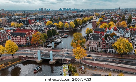 Aerial drone view Amsterdam autumn cityscape narrow old houses, canals, boats bird's eye view.  - Powered by Shutterstock