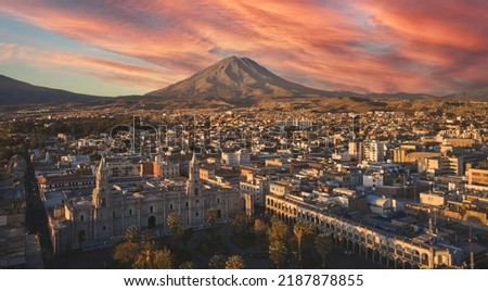Aerial drone view of Arequipa main square and cathedral church, with the Misti volcano at sunset. Arequipa, Peru.