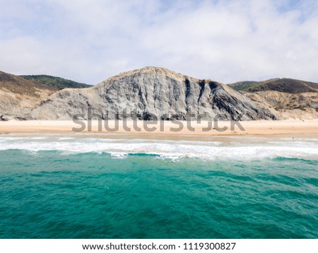 Aerial Drone View Of Blue Ocean Waves And Beautiful Sandy Beach Shore in Portugal