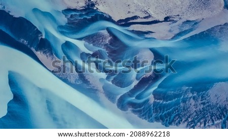 aerial drone view of a blue riverbed, glacial river system transporting deposits from vatnajokull glacier,Iceland 