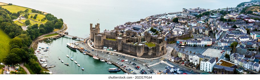 Aerial Drone View Of Caernarfon Castle And Battlements Along The River Seiont In North Wales