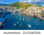Aerial drone view of Camara de Lobos village panorama near to Funchal, Madeira. Small fisherman village with many small boats in a bay