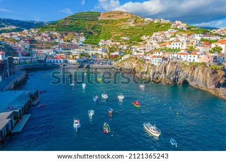 Aerial drone view of Camara de Lobos village panorama near to Funchal, Madeira. Small fisherman village with many small boats in a bay