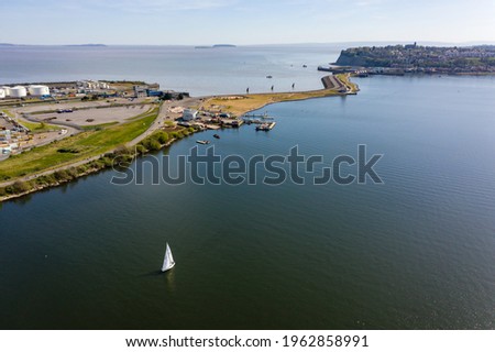 Aerial drone view of Cardiff Bay Barrage separating the lagoon from the tidal waters of the Bristol Channel
