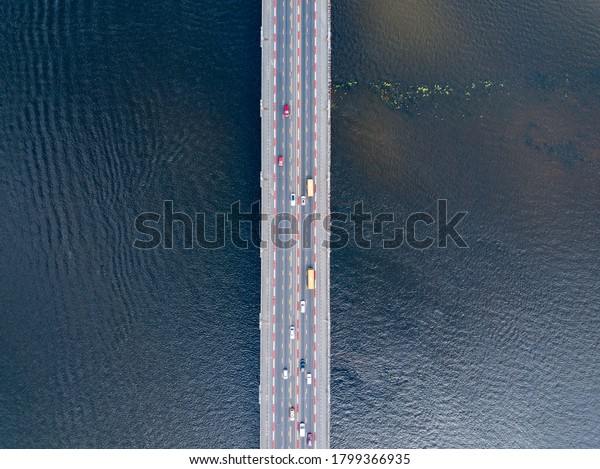 Aerial drone view. Cars travel across the Paton\
Bridge in Kiev.