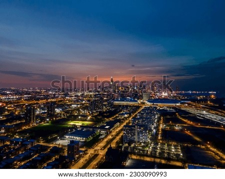 aerial drone view of the  city of Chicago during night  the major city metropolis architecture is a great tourist attraction. the lights from city streets illuminates the buildings 