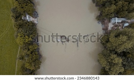 Aerial drone view of collapsed rope bridge close to Medno in Ljubljana, after heavy floods hit slovenia in the summer of 2023. Destroyed bridge over Sava river close to Ljubljana. Stok fotoğraf © 