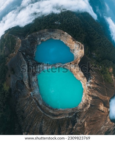 Aerial Drone view of Danau volcano Kelimutu in Ende, Flores island. Sunrise. Colorful crater lake. East Nusa Tenggara Aerial view