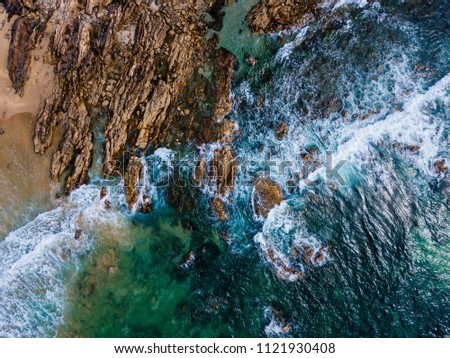 Similar – Aerial Drone View Of Dramatic Ocean Waves Crushing On Rocky Landscape