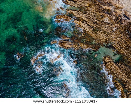 Similar – Aerial Drone View Of Dramatic Ocean Waves Crushing On Rocky Landscape