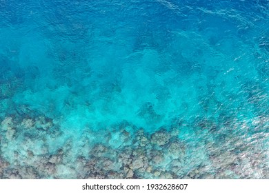 Aerial drone view of an endangered coral reef near the coast in the Maldives - Powered by Shutterstock