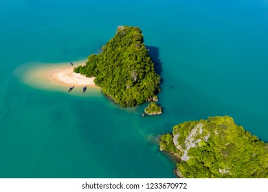 Aerial Drone View Of An Exotic, Tiny Tropical Island With Sandy Beach And Jungle