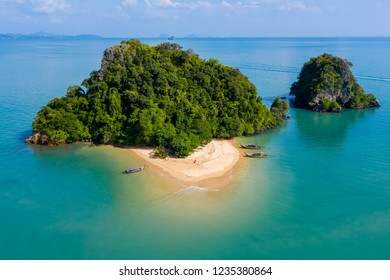 Aerial Drone View Of An Exotic, Tiny Tropical Island With Sandy Beach And Jungle