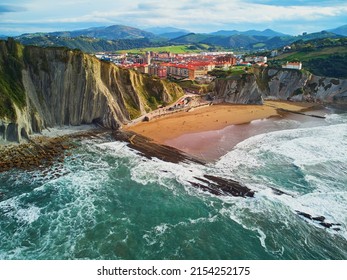Aerial drone view of famous flysch of Zumaia, Basque Country, Spain. Flysch is a sequence of sedimentary rock layers that progress from deep-water - Shutterstock ID 2154252175