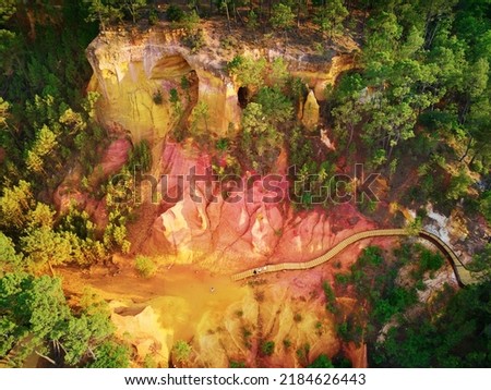 Aerial drone view of famous Ochre path (Sentier des Ocres in French) through large ochre deposits in Roussillon, Provence, France