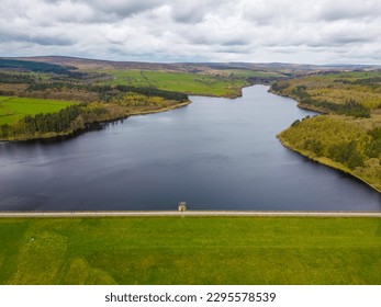 Aerial drone view of Fewston Reservoir dam feeding into Swinsty Reservoir. Part of Yorkshire Water reservoir supply of drinking water.
