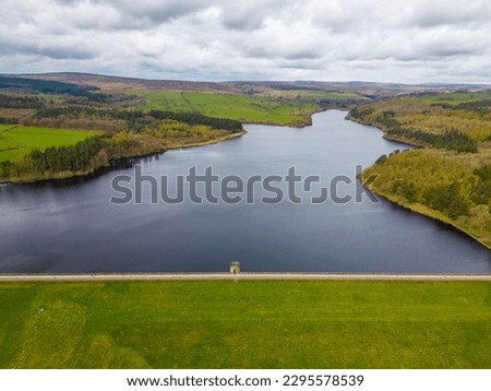 Aerial drone view of Fewston Reservoir dam feeding into Swinsty Reservoir. Part of Yorkshire Water reservoir supply of drinking water.