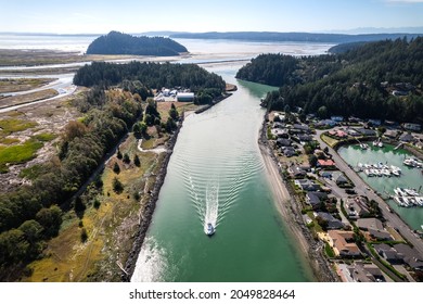 Aerial Drone View Of Fishing Vessel Traveling By Shelter Bay Up Swinomish Channel