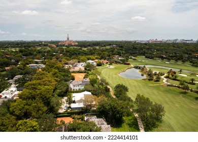 Aerial drone view of golf course area in coral gables, exclusive and luxurious neighborhood in miami, lush tropical vegetation, luxury homes