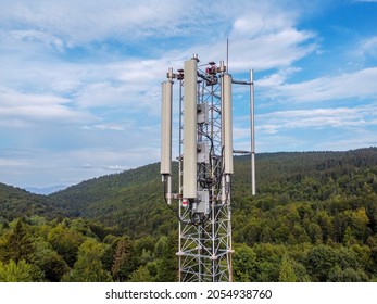 Aerial drone view of GSM and radio telecommunication tower in mountains. Cell phone tower. Base transceiver station. Wireless communication antenna transmitter.  