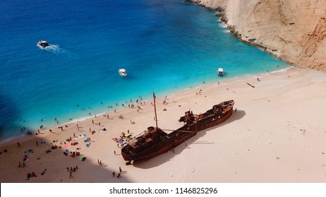 Aerial drone view of iconic beach of Navagio or Shipwreck voted one of the most beautiful beaches in the world with deep turquoise clear sea, Zakynthos island, Ionian, Greece