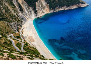 Aerial drone view of iconic turquoise and sapphire bay and beach of Myrtos, Kefalonia (Cephalonia) island, Ionian, Greece. Myrtos beach, Kefalonia island, Greece. Beautiful view of Myrtos beach. - Shutterstock ID 2162912605