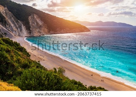Aerial drone view of iconic turquoise and sapphire bay and beach of Myrtos, Kefalonia (Cephalonia) island, Ionian, Greece. Myrtos beach, Kefalonia island, Greece. Beautiful view of Myrtos beach.