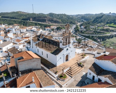 Aerial drone view of Iglesia Nuestra Señora De Las Flores (Our Lady of Flowers Church) in  Sanlucar de Guadiana village in Huelva province, Andalusia, Spain, on the banks of Guadiana river