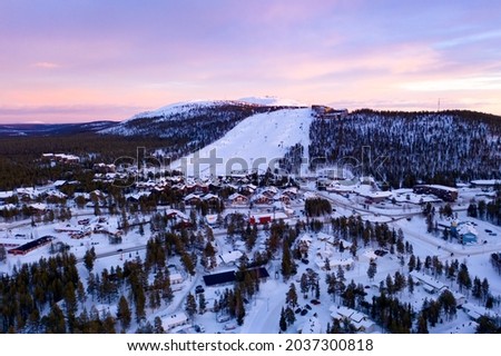 Aerial drone view of the Levi ski village, winter evening sunset, in Lapland