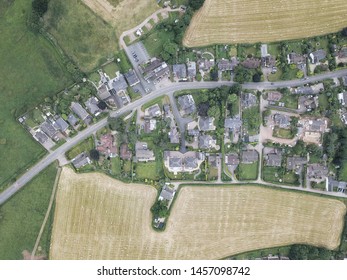 Aerial drone view looking down to countryside town and village of houses in England, Europe