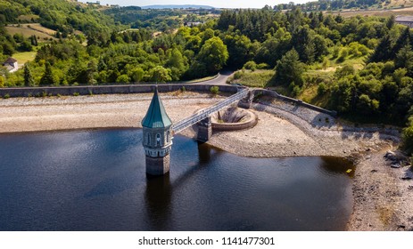 Aerial drone view of low water levels in Pontsticill Reservoir, Brecon Beacons during a summer heatwave