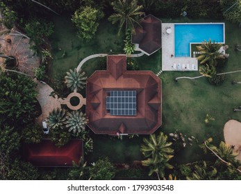 Aerial Drone View Of Luxury Villa With The Pool And Solar Panels On The Roof