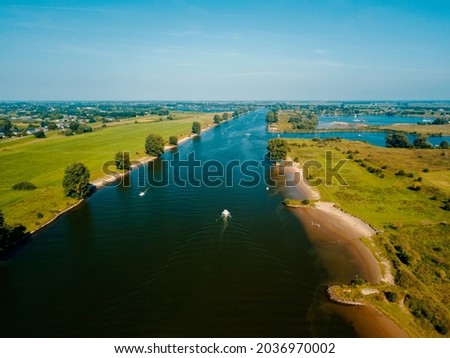 Aerial drone view of the Meuse river in the Netherlands, Europe.