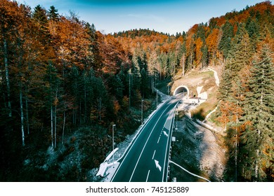 Aerial drone view of mountain overpass and modern road with tunnel Karaula in Bosnia and Herzegovina. Connection between Sarajevo and Tuzla. Toned image.