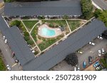 Aerial Drone view of a Multifamily residential apartment buildings complex with beautiful blue swimming pool in a nice neighborhood in Beaverton, Oregon