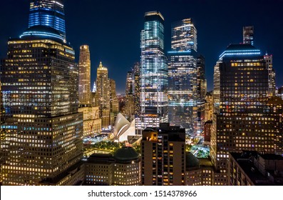 Aerial drone view of New York skyscrapers at night in Lower Manhattan