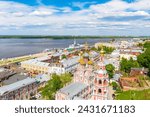 Aerial drone view of Nizhniy Novgorod city center with Volga embankment, Cathedral of the Blessed Virgin Mary Stroganoff church and Kremlin during sunny day, Russia.