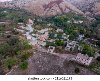Aerial drone view of Old Perithia, Corfu's oldest village, incredible ruins of stone build houses, close to Mount Pantokrator, abandoned village of Sinies. Greece.