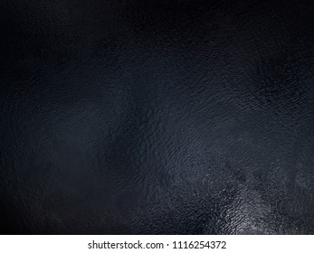 Aerial drone view on dark waters surface. Black water texture shot directly from above. Dark water of Dnipro river in Kyiv