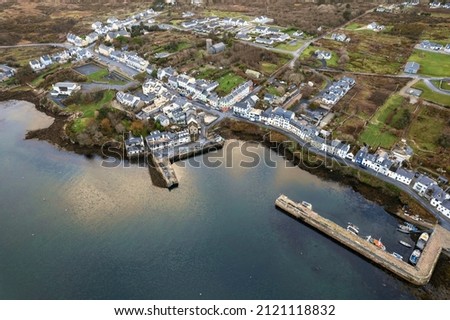 Aerial drone view on fishing town Roundstone in county Galway, Ireland located on Wild Atlantic Way route. Tourism and fishing industry. Beautiful Connemara nature scenery.