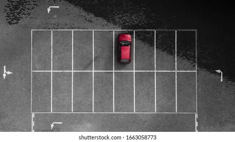 Aerial Drone View Of One Red Car Parked