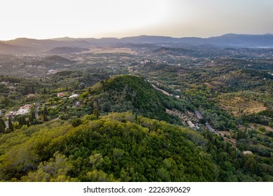 Aerial drone view over typical rural landscape in central Island of Corfu at sunset, Greece.